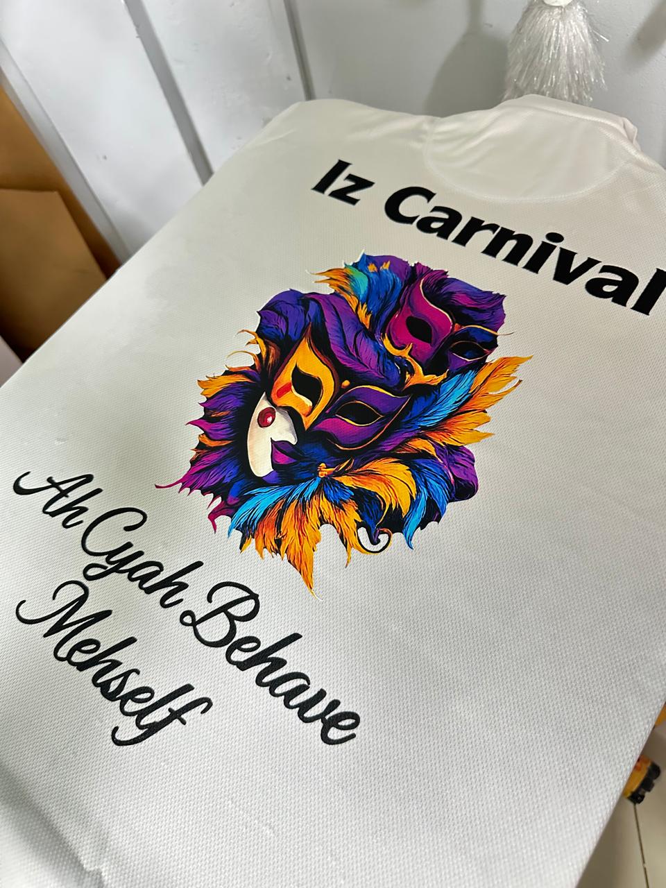 White garment featuring a colourful carnival mask and black lettering.
